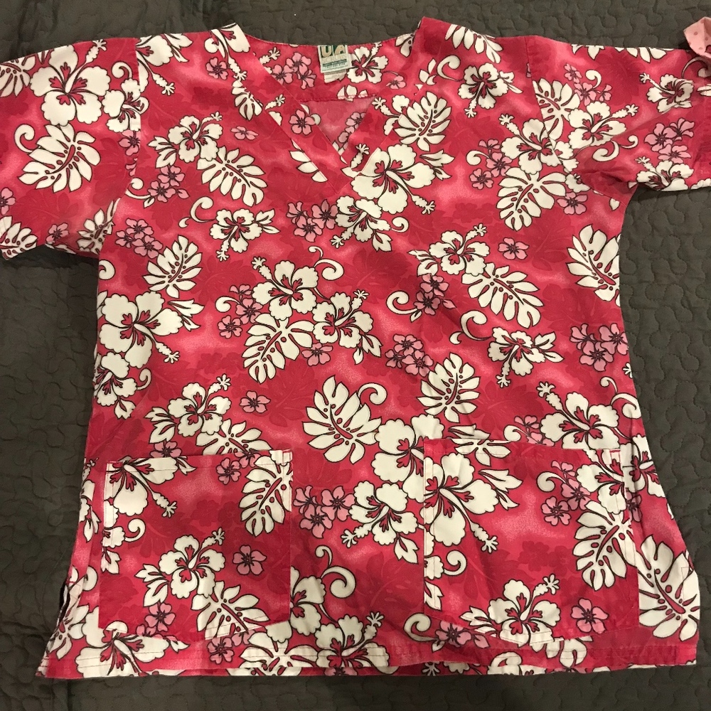 a pair of Scrub tops size small
